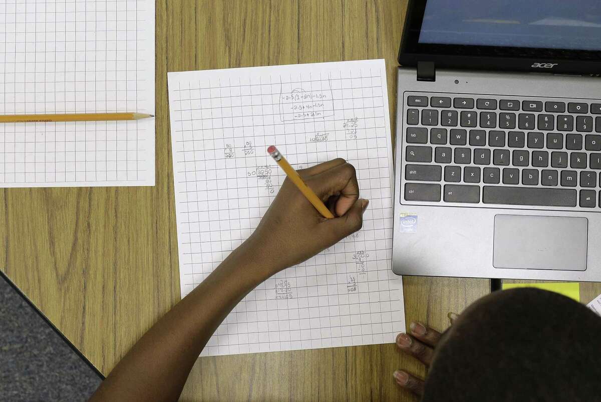 In this Feb. 12 photo, Yamarko Brown, 12, works on math problems as part of a trial run of a new state assessment test at Annapolis Middle School in Annapolis, Md. The new test, which is scheduled to go into use March 2, is linked to the Common Core standards, which Maryland adopted in 2010 under the federal No Child Left Behind law.