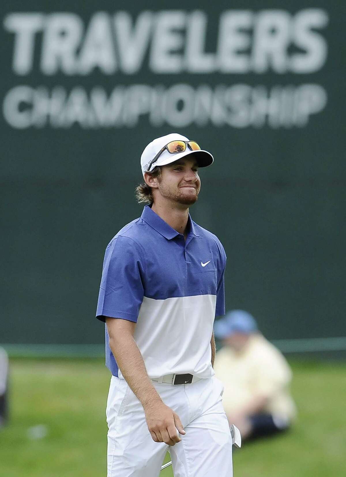 Patrick Rodgers reacts to a birdie putt on the 17th hole during the third round of the Travelers Championship on Saturday in Cromwell.