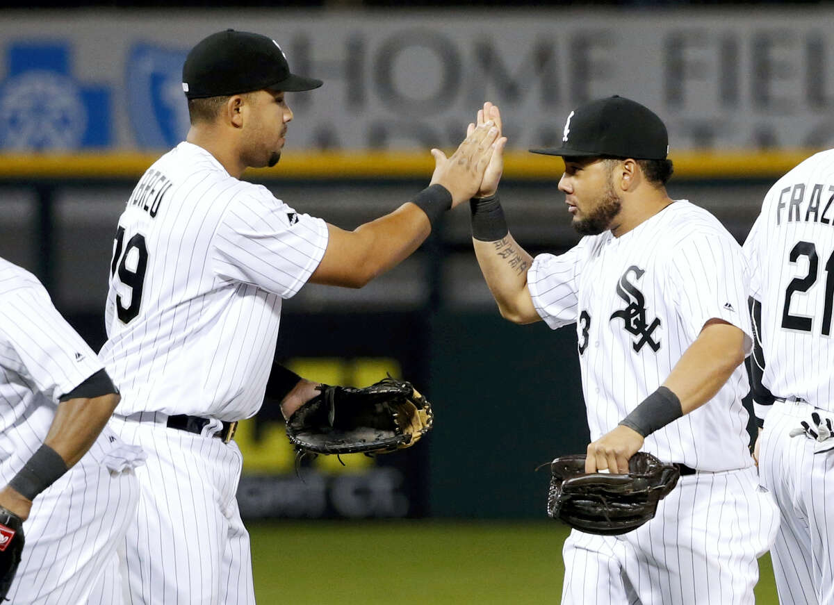 Chicago White Sox first baseman Jose Abreu (79) and Melky Cabrera celebrate the White Sox’s 4-1 win over the Boston Red Sox Tuesday, May 3, 2016, in Chicago.