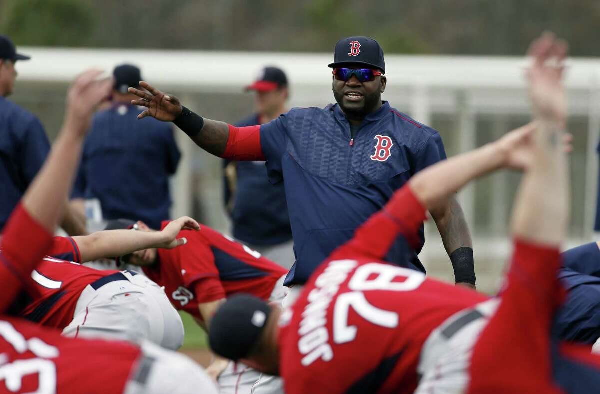Boston Red Sox DH David Ortiz talks with teammates during stretching on Wednesday in Fort Myers Fla.