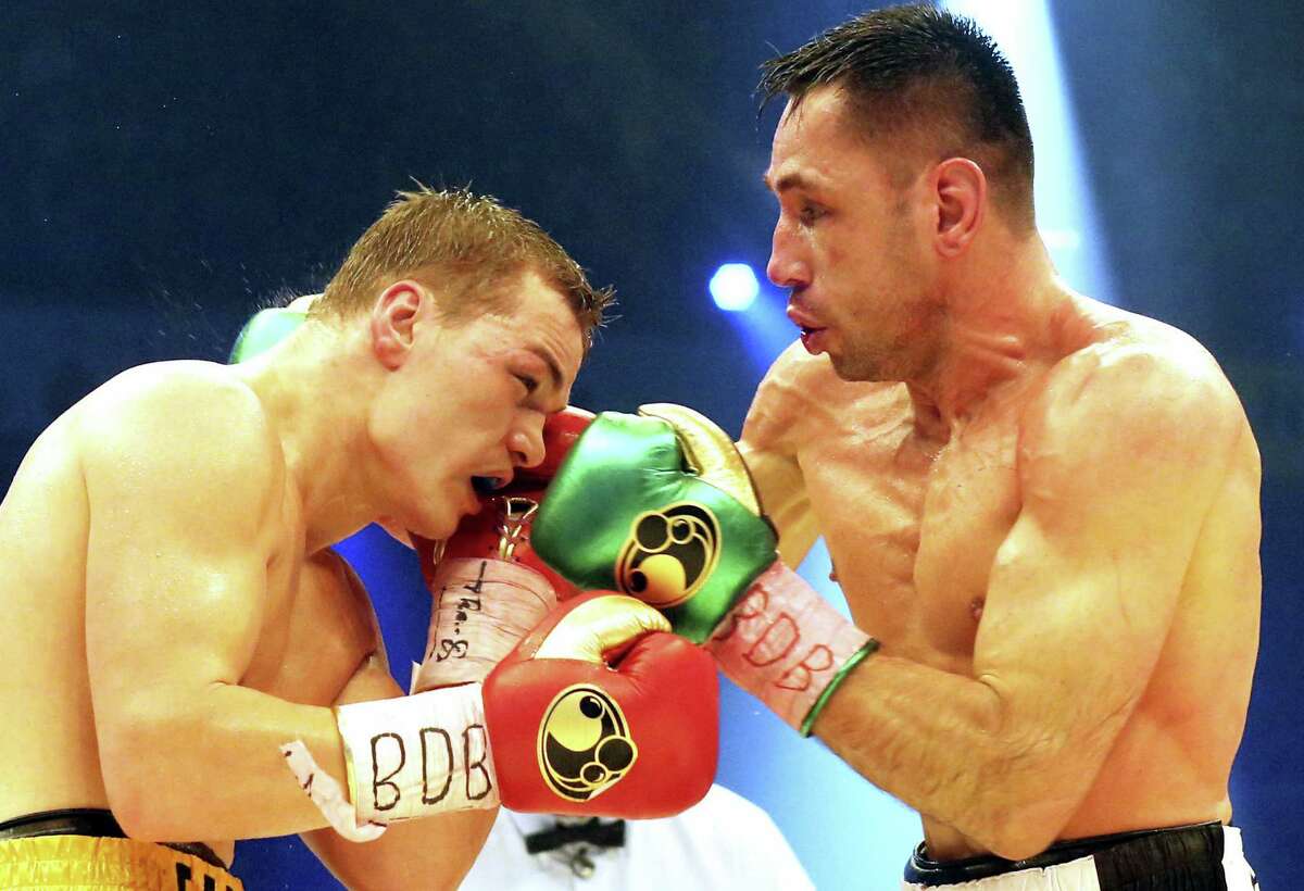 In this Feb. 20, 2016 picture, Germany’s Felix Sturm, right, challenges with Russia’s Fedor Chudinov, during a WBA super middleweight title bout in Oberhausen, Germany. German prosecutors have opened a criminal investigation against Sturm because of doping.