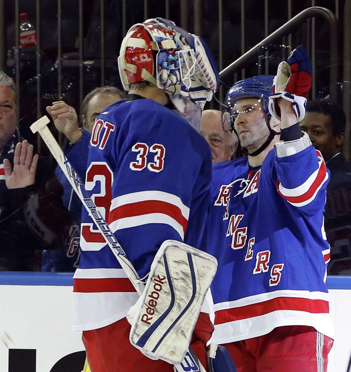 New York Rangers right wing Martin St. Louis (26) celebrates with goalie Cam Talbot after a win over the Columbus Blue Jackets at Madison Square Garden in New York on Sunday.