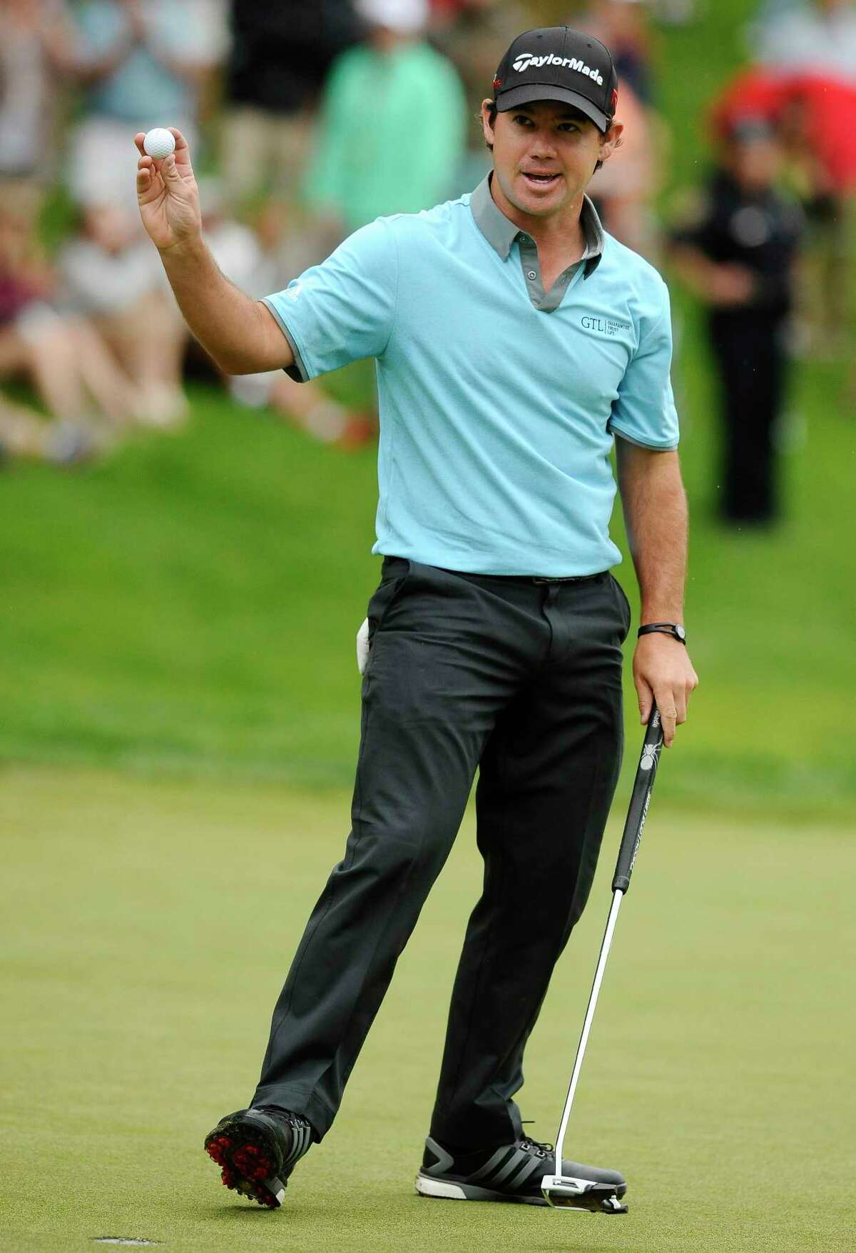 Brian Harman reacts after making a birdie on the 18th and taking the lead after three rounds of the Travelers Championship on Saturday in Cromwell.