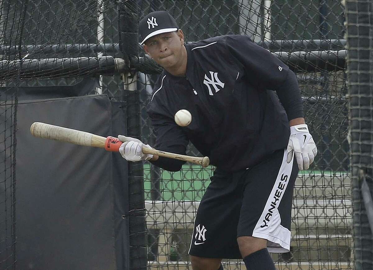 New York Yankees third baseman Alex Rodriguez bunts in the batting cage while working out at the minor league complex on Wednesday in Tampa, Fla.