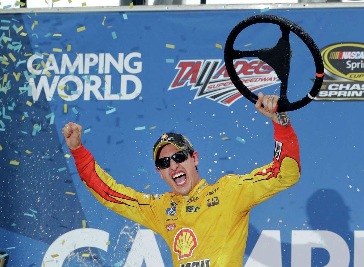 Joey Logano reacts in Victory Lane after winning the NASCAR Sprint Cup race at Talladega Superspeedway on Sunday.