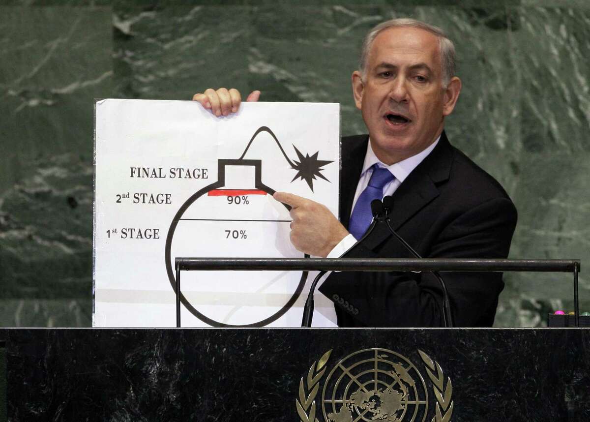 FILE - In this Thursday, Sept. 27, 2015 file photo, Israeli Prime Minister Benjamin Netanyahu shows an illustration as he describes his concerns over Iran's nuclear ambitions during his address to the 67th session of the United Nations General Assembly at U.N. headquarters. In his sharpest criticism yet, Israeli Prime Minister Benjamin Netanyahu said Wednesday, Feb. 25, 2015 that world powers "have given up" on stopping Iran from developing nuclear weapons in ongoing negotiations.(AP Photo/Richard Drew, File)