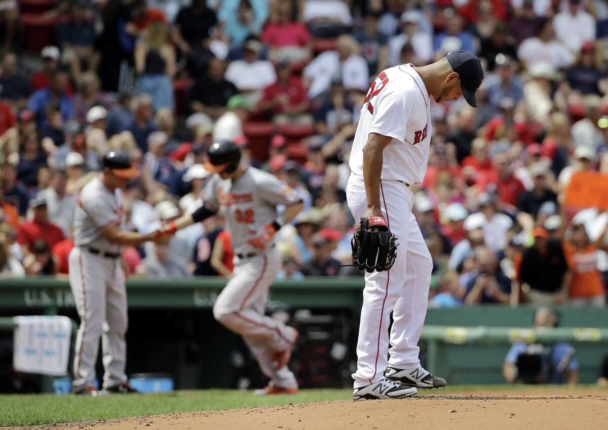 Red Sox starter Eduardo Rodriguez reacts after giving up a two-run home run to Baltimore Orioles catcher Matt Wieters on Thursday afternoon in Boston.