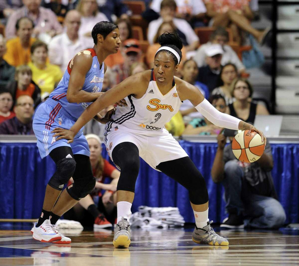 Connecticut’s Kelsey Bone (3) is guarded by the Atlanta Dream’s Angel McCoughtry during the Sun’s 82-64 win on June 14 in Uncasville.