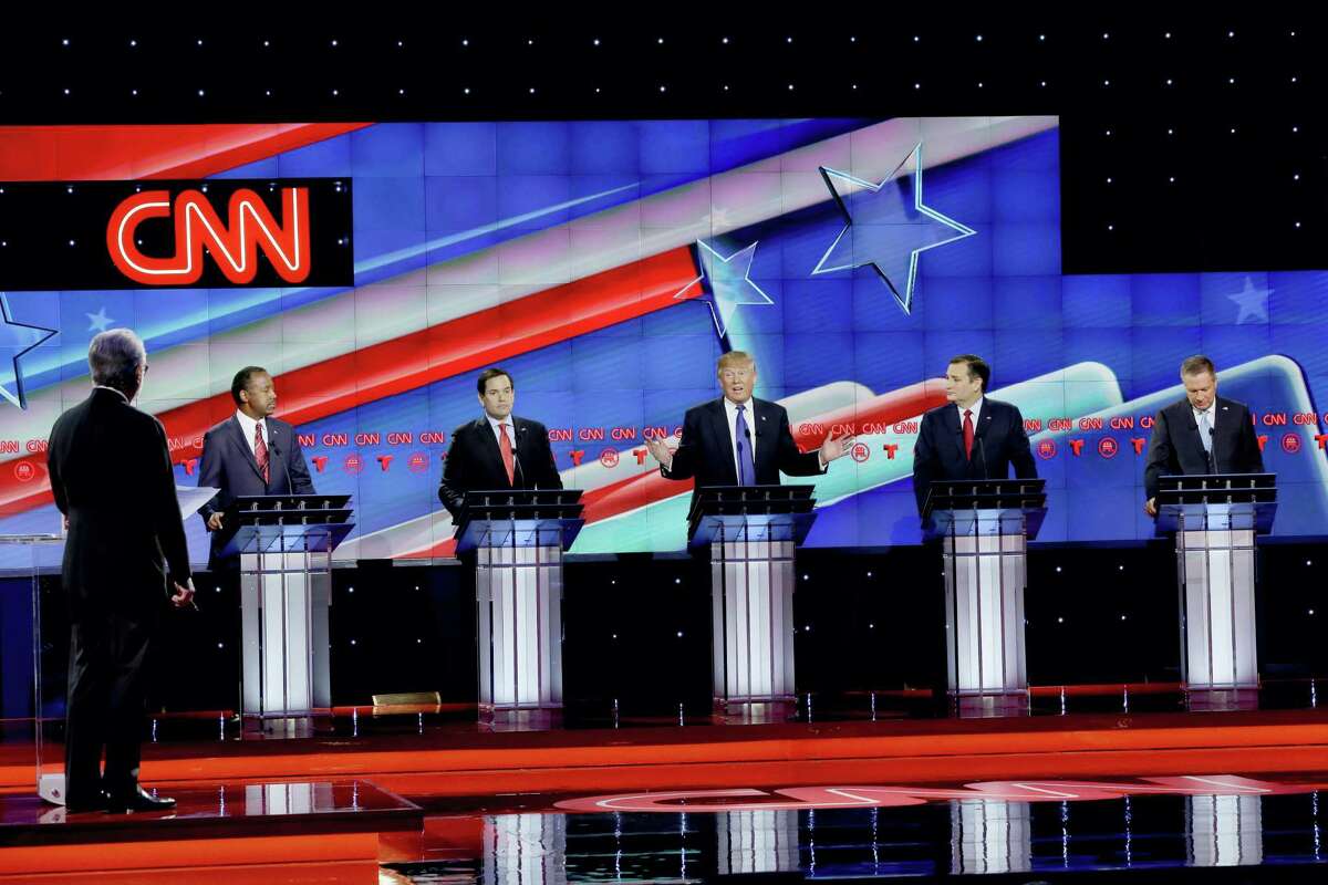 As Republican presidential candidate, businessman Donald Trump, center, speaks, Republican presidential candidates, retired neurosurgeon Ben Carson, left, Sen. Marco Rubio, R-Fla., second from left, Sen. Ted Cruz, R-Texas, second from right and Ohio Gov. John Kasich, right, look on during a Republican presidential primary debate at The University of Houston, Thursday, Feb. 25, 2016, in Houston.