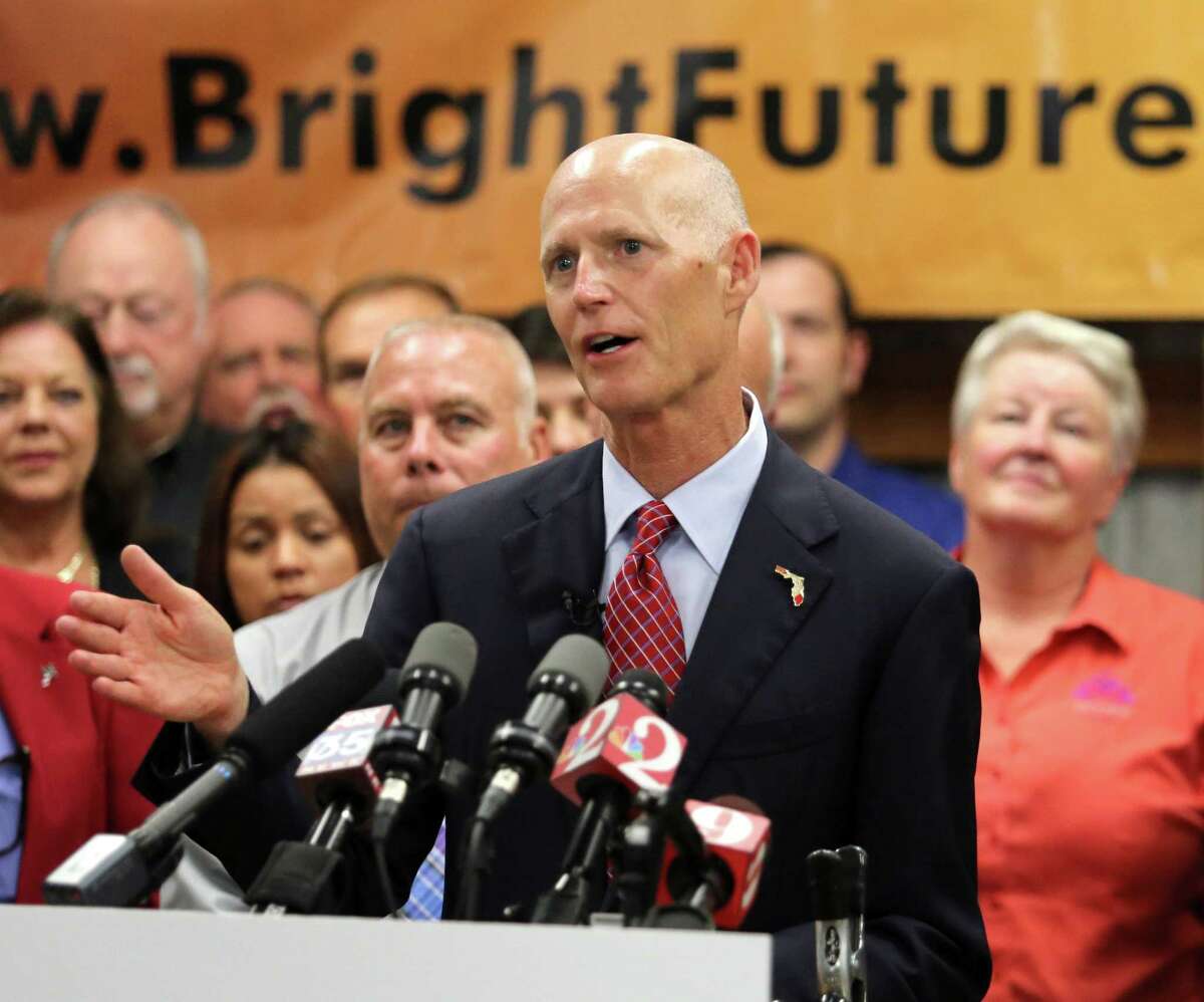Florida Gov. Rick Scott delivers remarks on jobs growth during a visit to Bright Future Electric, an electrical contractor business with offices in Florida and Alabama, Thursday, June 11, 2015, in Ocoee, Fla. (Joe Burbank/Orlando Sentinel via AP)