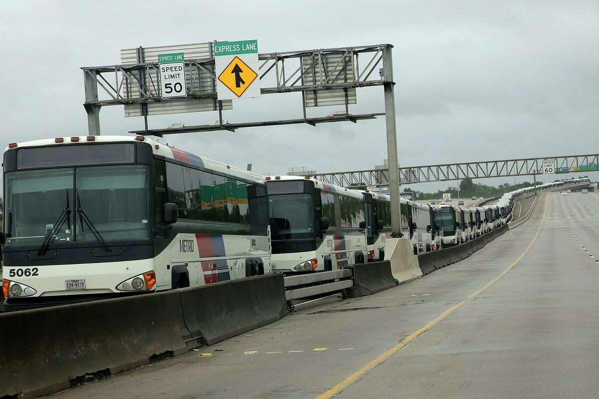 Metro buses line the HOV lane on Interstate 69 near Kashmere as a precaution in case of flooding in the bus barn close on Aug. 26, 2017. The decision likely saved the 120 buses from damage.