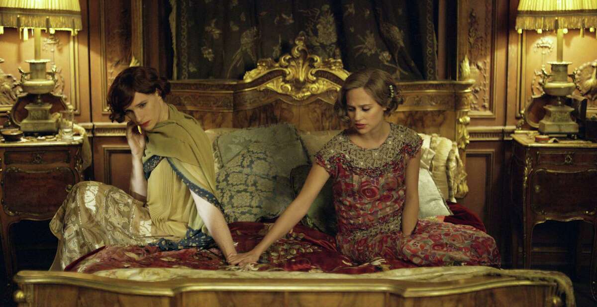 This file photo provided by Focus Features shows, Eddie Redmayne, left, as Lili Elbe, and Alicia Vikander as Gerda Wegener, in Tom Hooper’s “The Danish Girl.” Hollywood films remained static in their inclusiveness of LGBT characters in 2015, but the racial diversity of those characters fell dramatically, according to the findings of GLAAD’s annual study released on May 2, 2016.