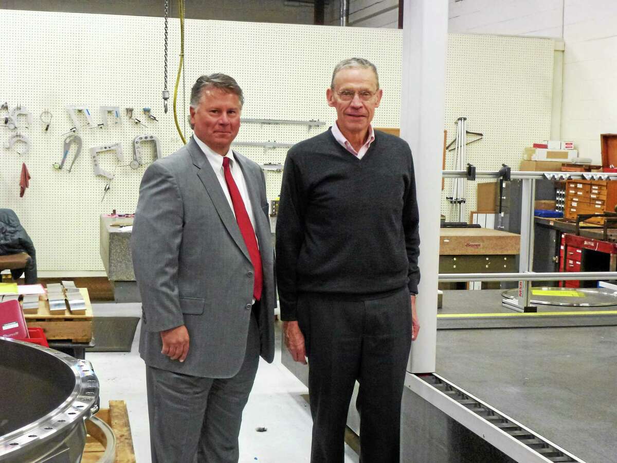 Air Industries Group CEO Daniel Godin, left, and Sterling Engineering President John Lavieri in the machine shop this week.