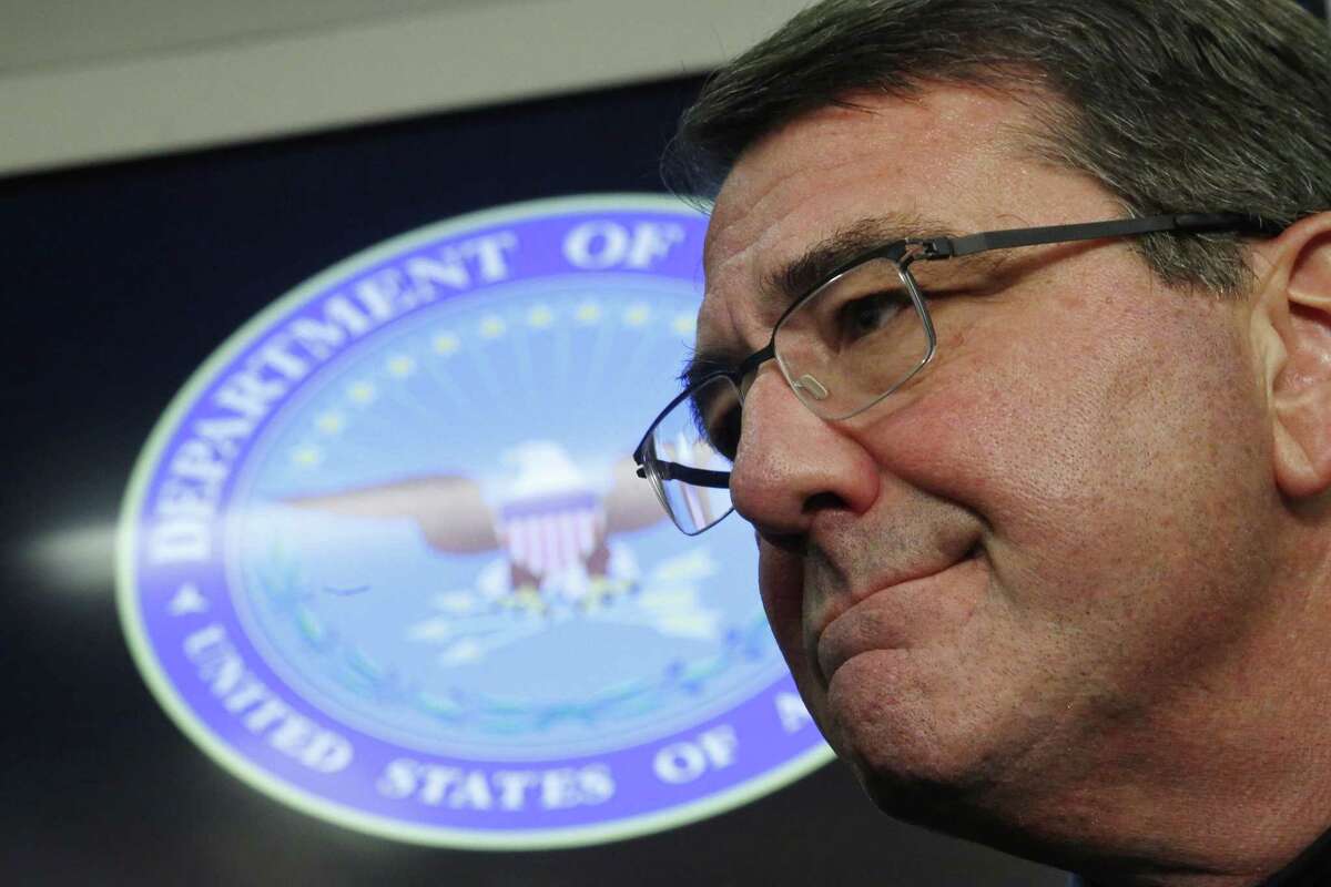 U.S. Secretary of Defense Ashton Carter listens to questions during a press conference on board his plane en route to Afghanistan on Feb. 20, 2015.