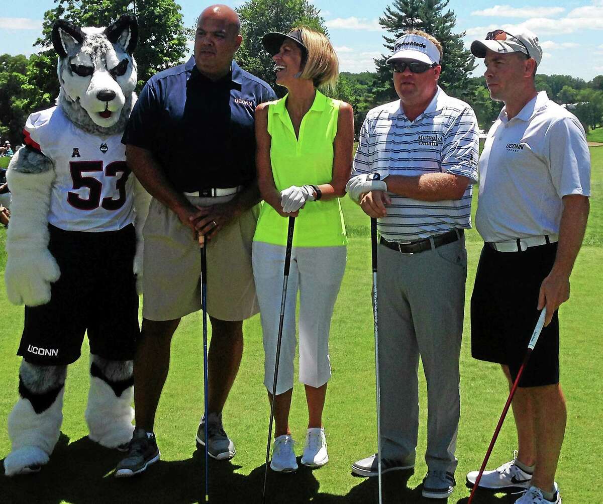 From left, the UConn mascot, AD Warde Manuel, associate women’s basketball head coach Chris Dailey, pro Carl Petersson and UConn men’s hockey coach Mike Cavanaugh pose before teeing off at Wednesday’s Travelers Celebrity Pro-Am.