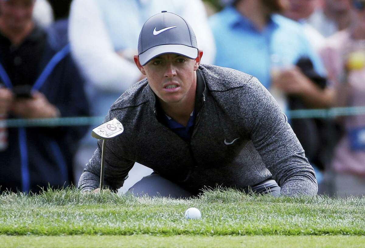 Rory McIlroy lines up a putt on the 15th hole during the final round of the Deutsche Bank Championship golf tournament in Norton, Mass., Monday. McIlroy won the tournament by two shots.