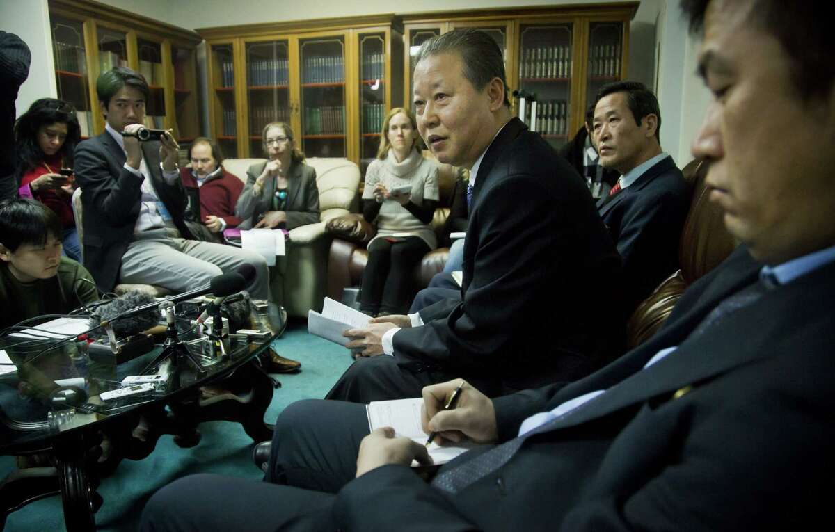 North Korea’s U.N. Ambassador Jang II Hun, third from right, is seated between North Korea’s mission consulars Kin Song, second from right, and Kwon Jong Gun, far right, as he speaks during a press conference on Feb. 16 at North Korea’s Mission in New York. North Korea says it will respond “very strongly” to a conference in Washington on Tuesday about its widespread human rights abuses.
