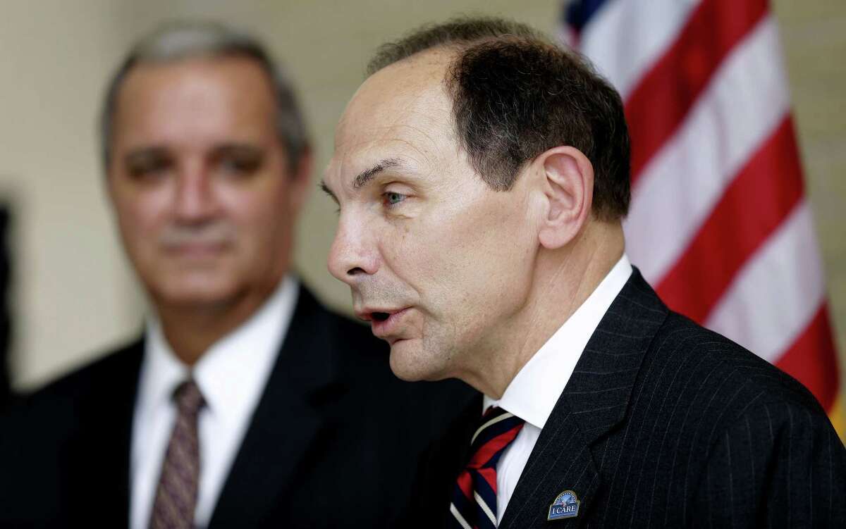 In this photo taken Oct. 1, 2014, Veterans Affairs Secretary Robert A. McDonald, right, accompanied House Veterans Affairs Committee Chairman Rep. Jeff Miller, R-Fla., speaks in Tampa, Fla.