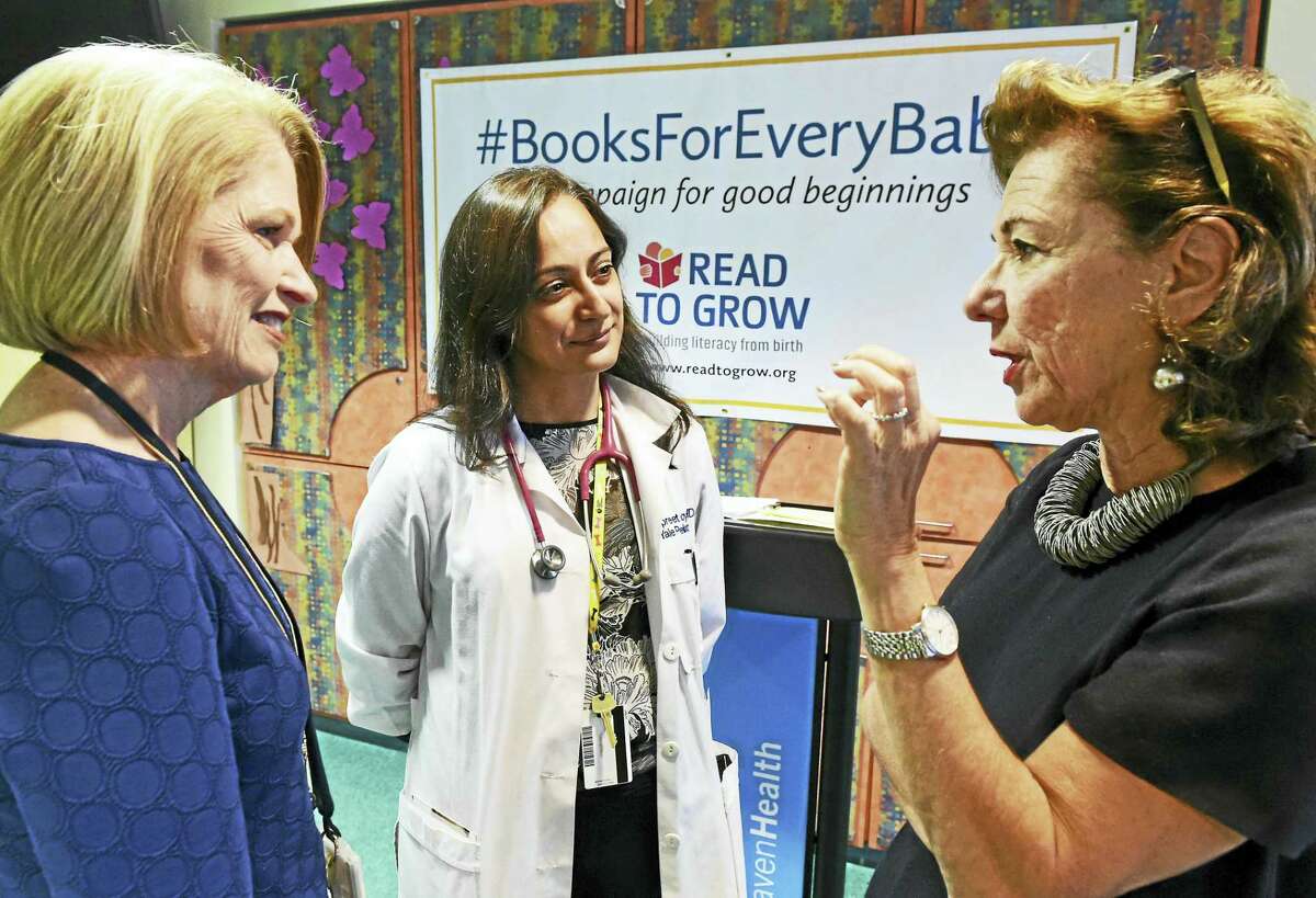 From left, Marna Borgstrom, president and CEO of Yale New Haven Health, Dr. Jaspreet Loyal, medical director of the Yale-New Haven Hospital well newborn nursery, and Roxanne Coady, owner of R.J. Julia Booksellers in Madison and board chairwoman of Read to Grow.