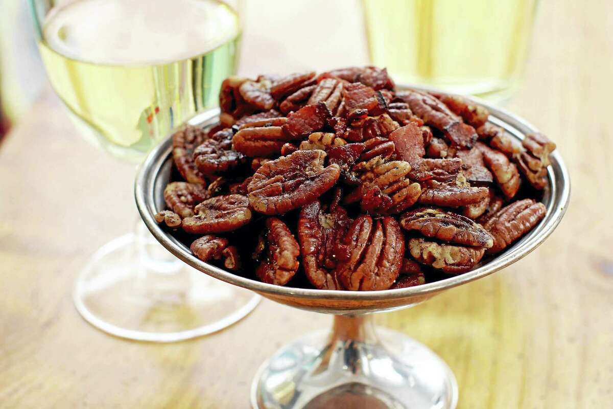 Offer up some spiced bacon pecans at your Oscar party. Once the bacon is nice and crispy, all you have to do is toss in some pecans and a whole mess of seasonings.