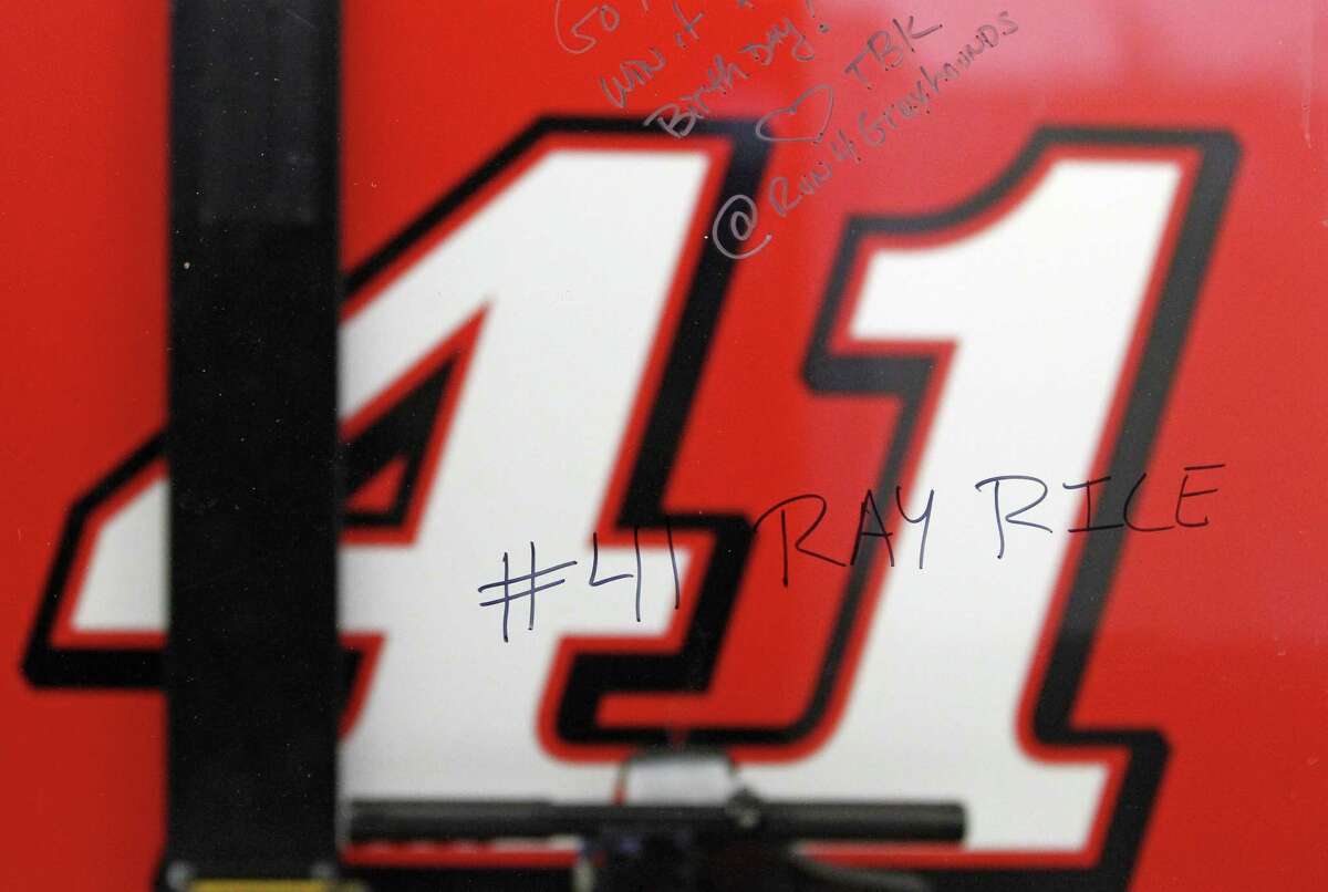 A window outside driver Kurt Busch’s garage stall shows a reference to NFL player Ray Rice written by a spectator Friday at Daytona International Speedway in Daytona Beach, Fla.