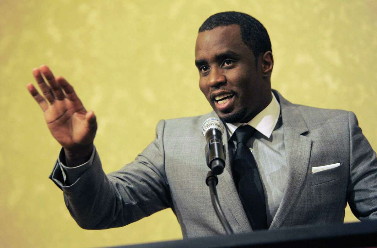 In this July 26, 2013 photo, Sean “Diddy” Combs of the new network Revolt TV addresses reporters at the Beverly Hilton Hotel in Beverly Hills, Calif.
