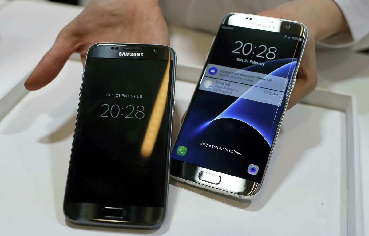 A Samsung Galaxy S7, left, and S7 Edge are displayed during the Samsung Galaxy Unpacked 2016 event on the eve of the Mobile World Congress wireless show, in Barcelona, Spain. Samsung announced Thursday, June 30, 2016, the company will sell unlocked versions of its flagship Galaxy S7 phones in the U.S. so consumers can switch carriers more easily.