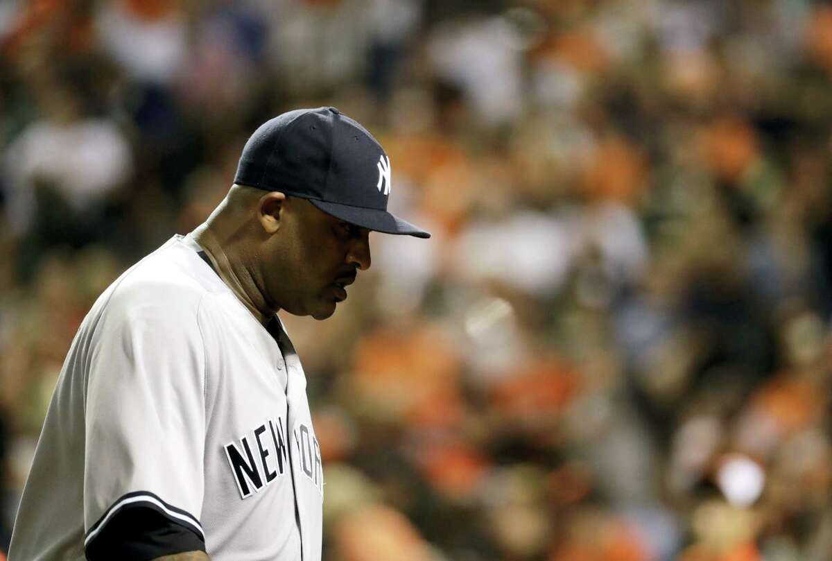 Yankees starting pitcher CC Sabathia walks off the field at the end of the sixth inning.