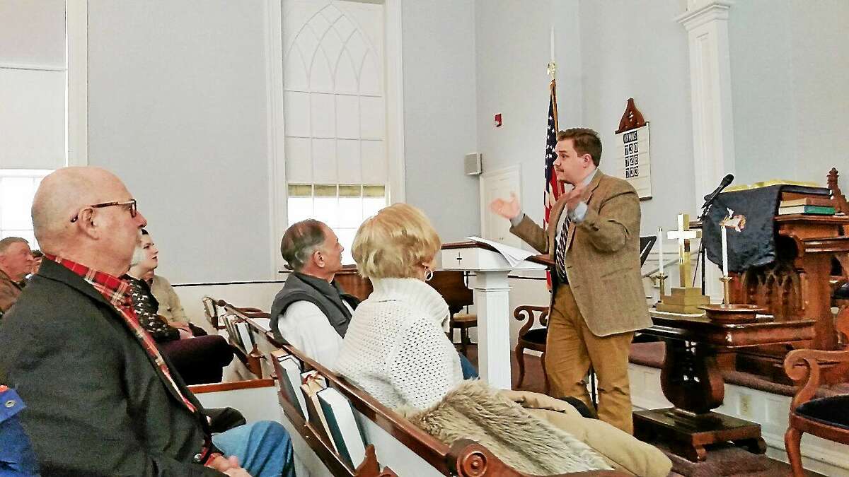 Actor and historian Luke G. Boyd discusses the mystery of The Colt Armory Fire of 1864 with a group of 30 people in attendance on Saturday afternoon at First Congregational Church at 865 Riverside Ave., Torrington.