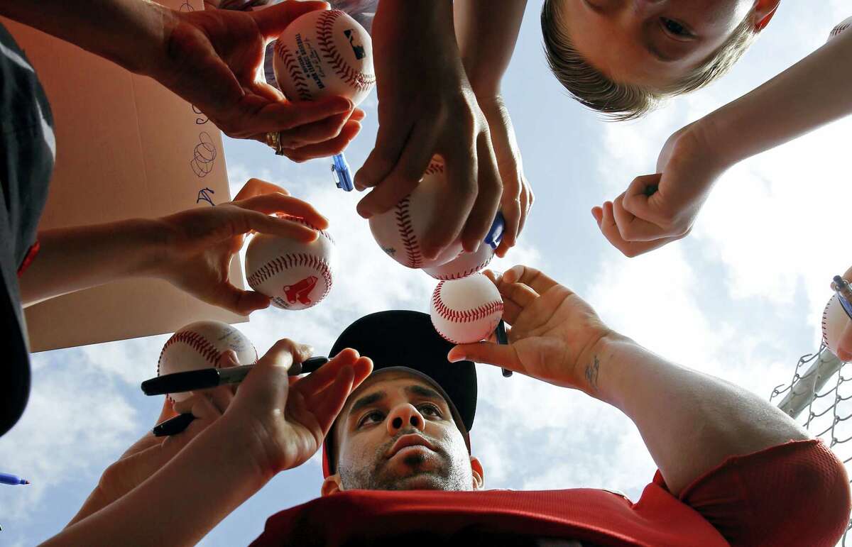 David Price signs autographs for fans after a spring training workout in Fort Myers, Fla., on Saturday.