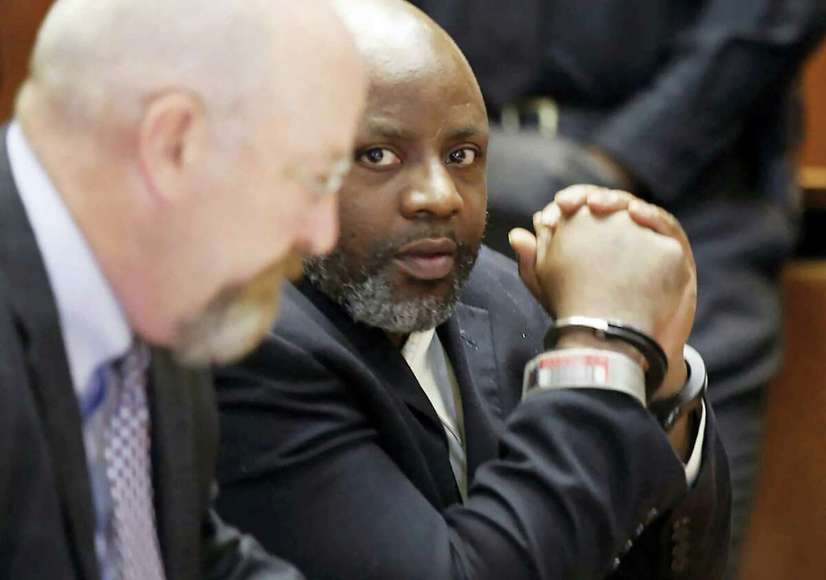 Defendant Shawn Custis, right, sits in court with his attorney John McMahon before he was sentenced to life plus 5 years by Superior Court Judge Ronald Wigler Wednesday, June 29, 2016, in Newark, N.J. Earlier Custis was found guilty in the brutal beating of a woman during a 2013 home invasion caught on a nanny-cam home security video.
