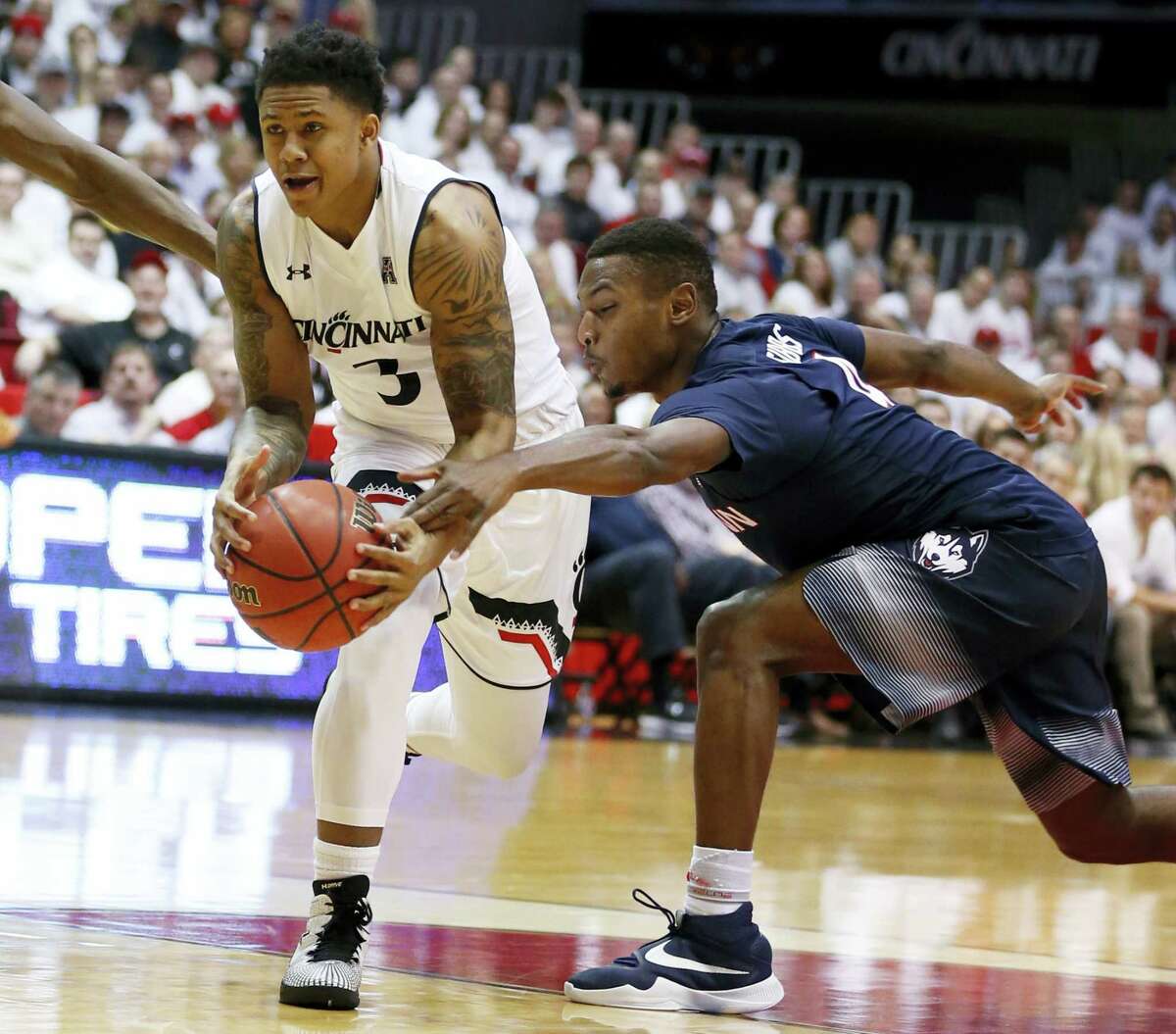 UConn’s Sterling Gibbs, right, attempts a steal on Saturday.
