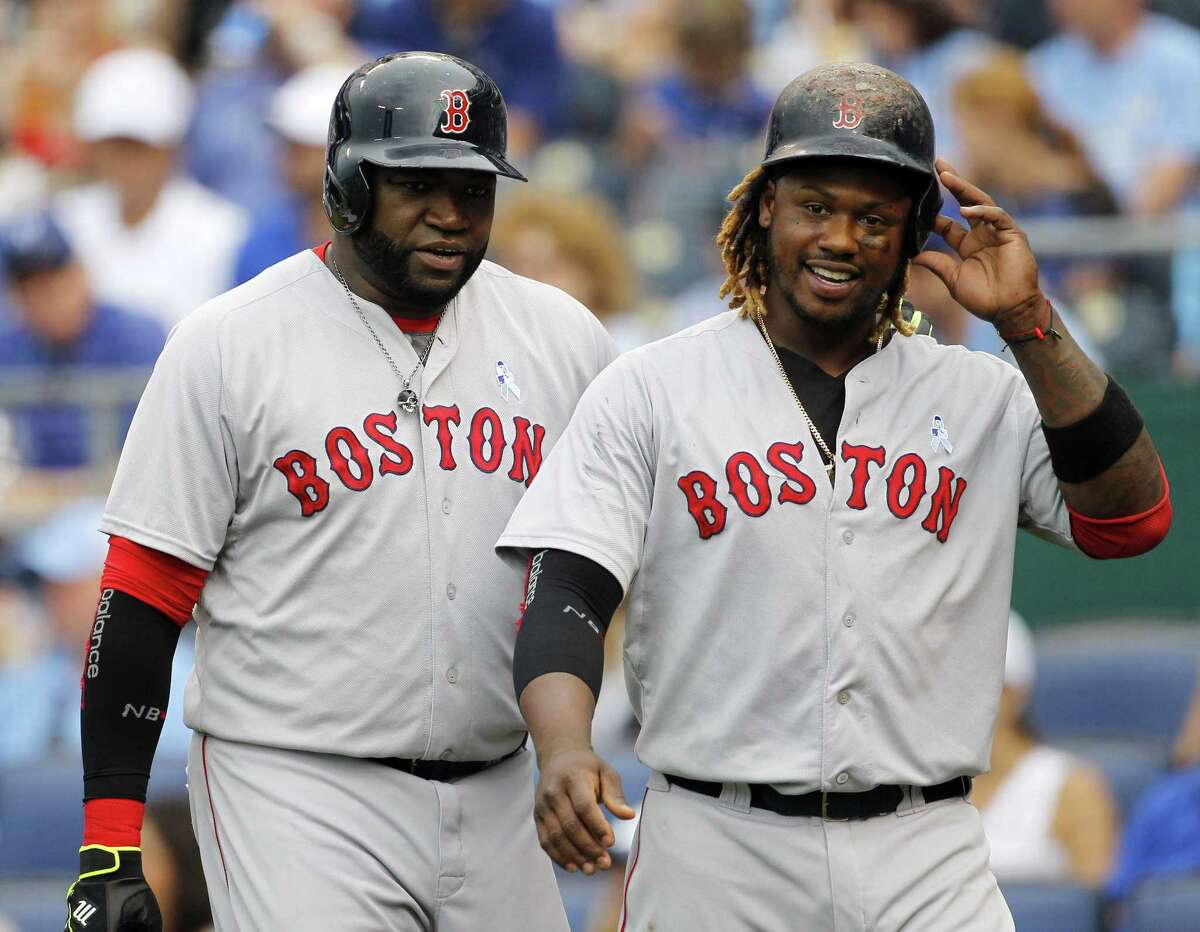 David Ortiz, left, and Hanley Ramirez, right, head to the dugout after scoring on a Xander Bogaerts double in the fifth inning on Sunday.