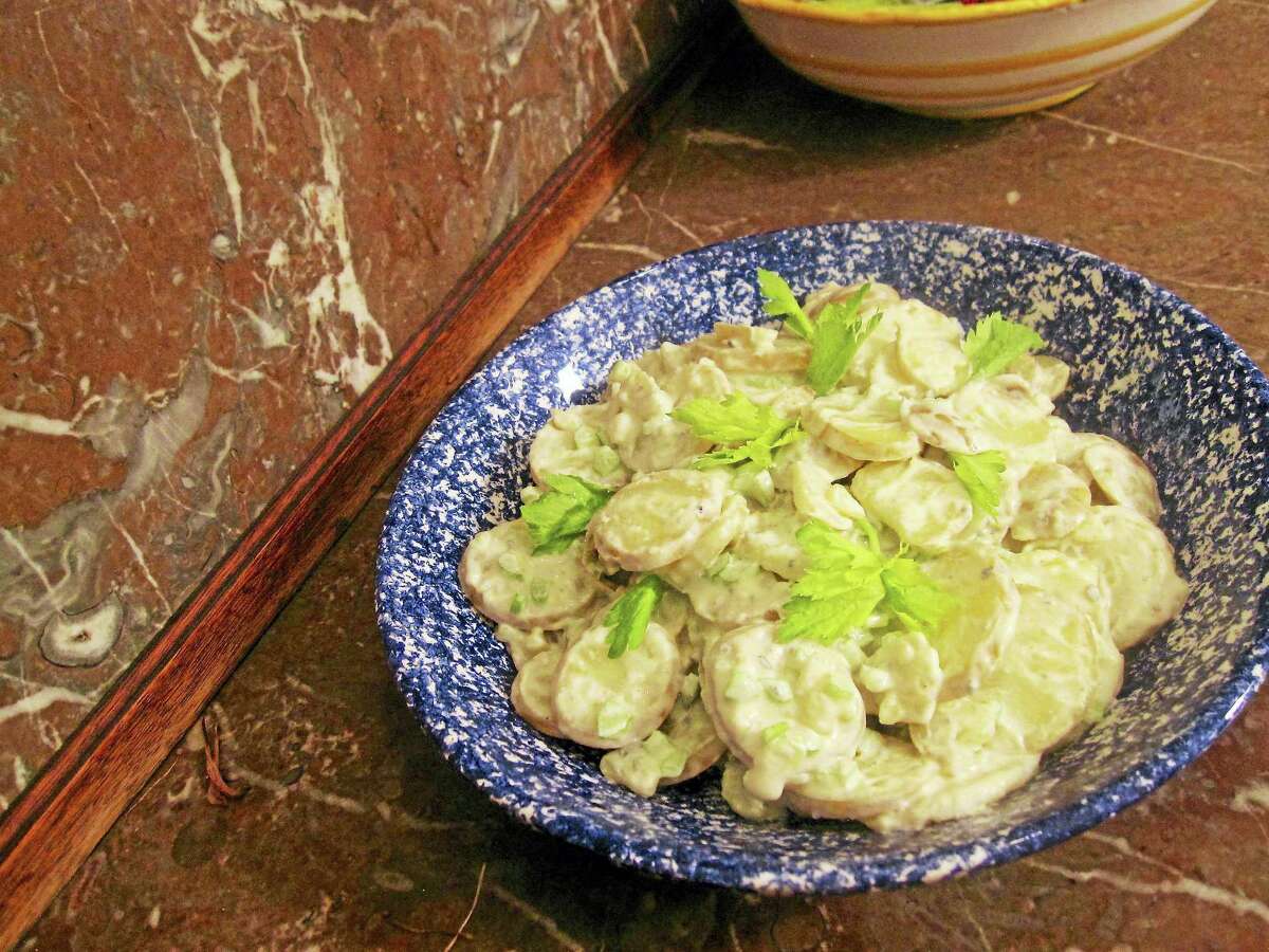 Both baking potatoes and boiling potatoes are used in this creamy Buffalo potato salad.