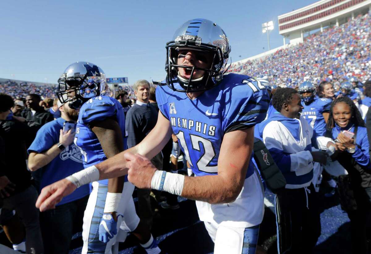 Memphis quarterback Paxton Lynch (12) yells as he celebrates after Memphis upset No. 13 Mississippi 37-24 on Saturday.