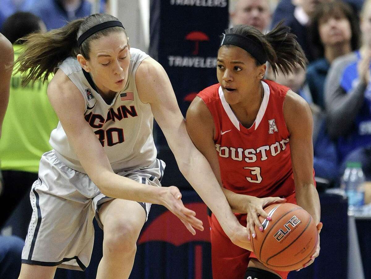UConn’s Breanna Stewart and Houston’s Bianca Winslow (3) fight for a loose ball during the first half of the top-ranked Huskies’ 85-26 win on Tuesday night at the XL Center in Hartford.