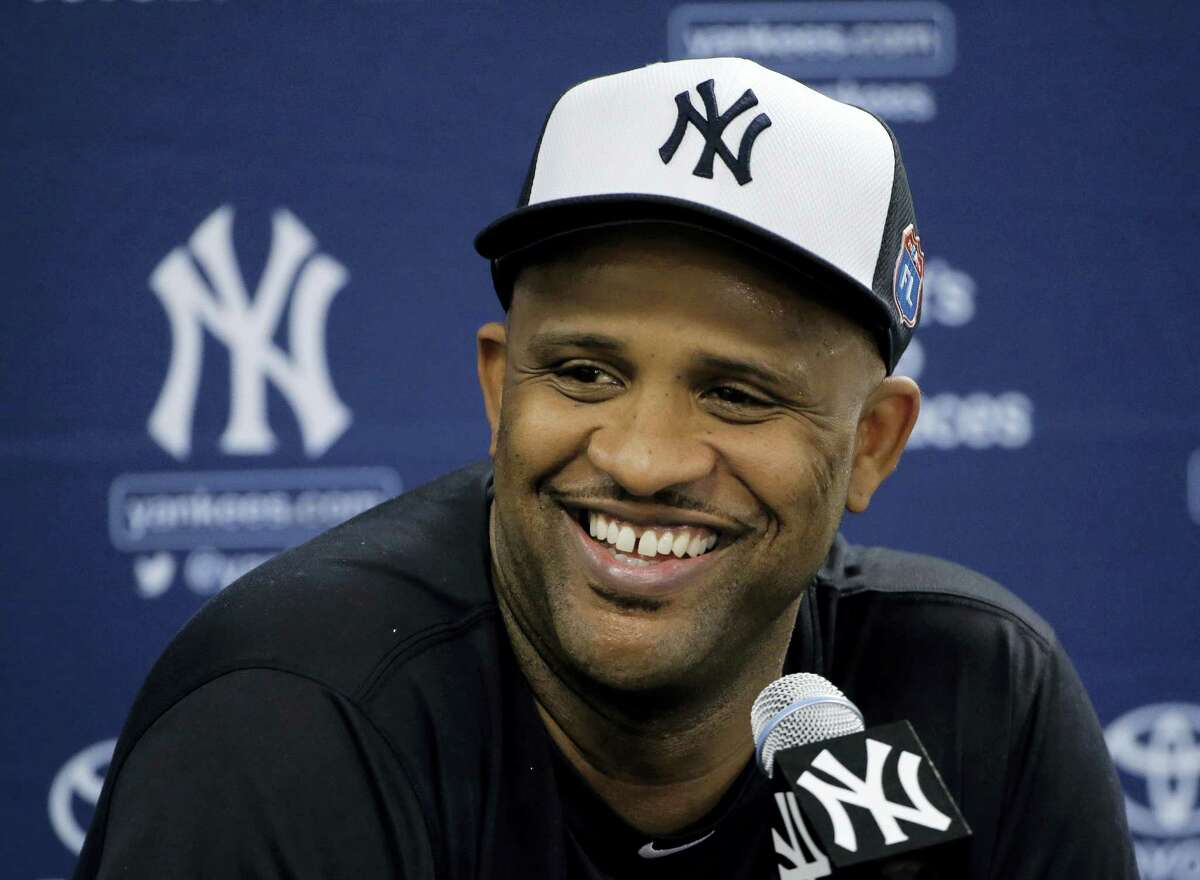 Yankees pitcher CC Sabathia smiles during a news conference Friday in Tampa, Fla.
