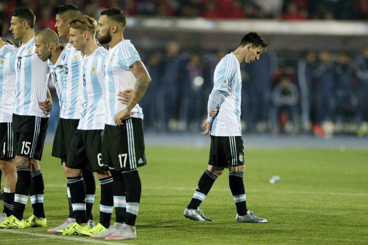Argentina’s Lionel Messi, right, reacts after Argentina’s Gonzalo Higuain, missed his penalty kick against Chile during the 2015 Copa America final soccer match in Santiago, Chile.