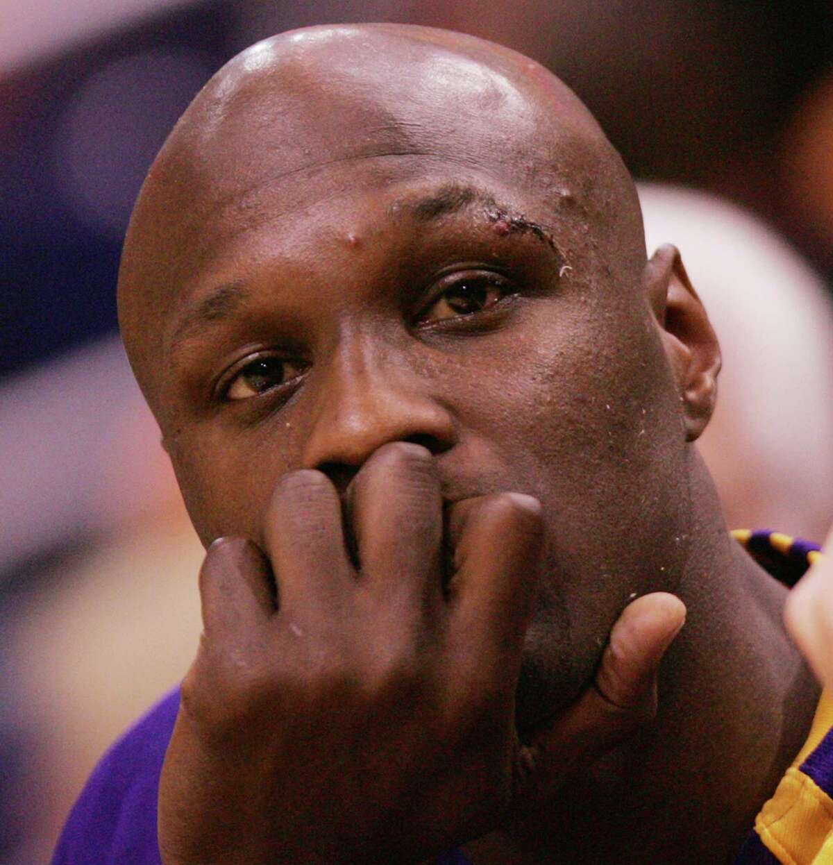 In this April 24, 2007, file photo, Los Angeles Lakers’ Lamar Odom sits on the bench in the fourth quarter of a Western Conference playoff basketball game against the Phoenix Suns in Phoenix. Odom, who was embraced by teammates and television fans alike for his Everyman approach to fame, was found face-down and alone Tuesday, Oct. 13, 2015, after spending four days at the Love Ranch, a legal Nevada brothel.