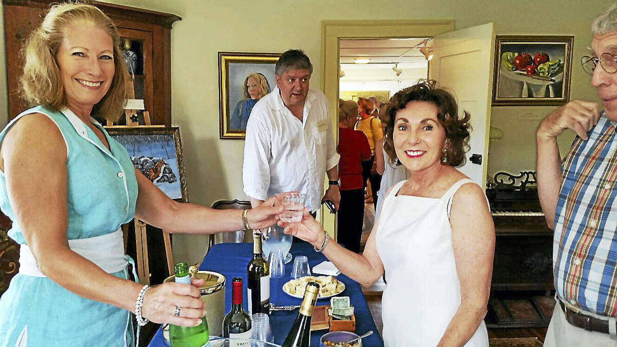 Photo by N.F. AmberyColebrook Historical Society President Carol Lord serves beverages to visitors at the Historical Society’s 2016 group art show “Artists Abound” at 558 Colebrook Road in Colebrook on Sunday afternoon. About 300 people attended the open house and art show and sale that featured 20 local artists and craftspeople.