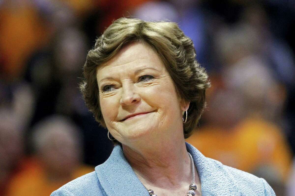 In this Jan. 28, 2013 photo, former Tennessee women’s basketball coach Pat Summitt smiles as a banner is raised in her honor before the team’s NCAA college basketball game against Notre Dame in Knoxville, Tenn.