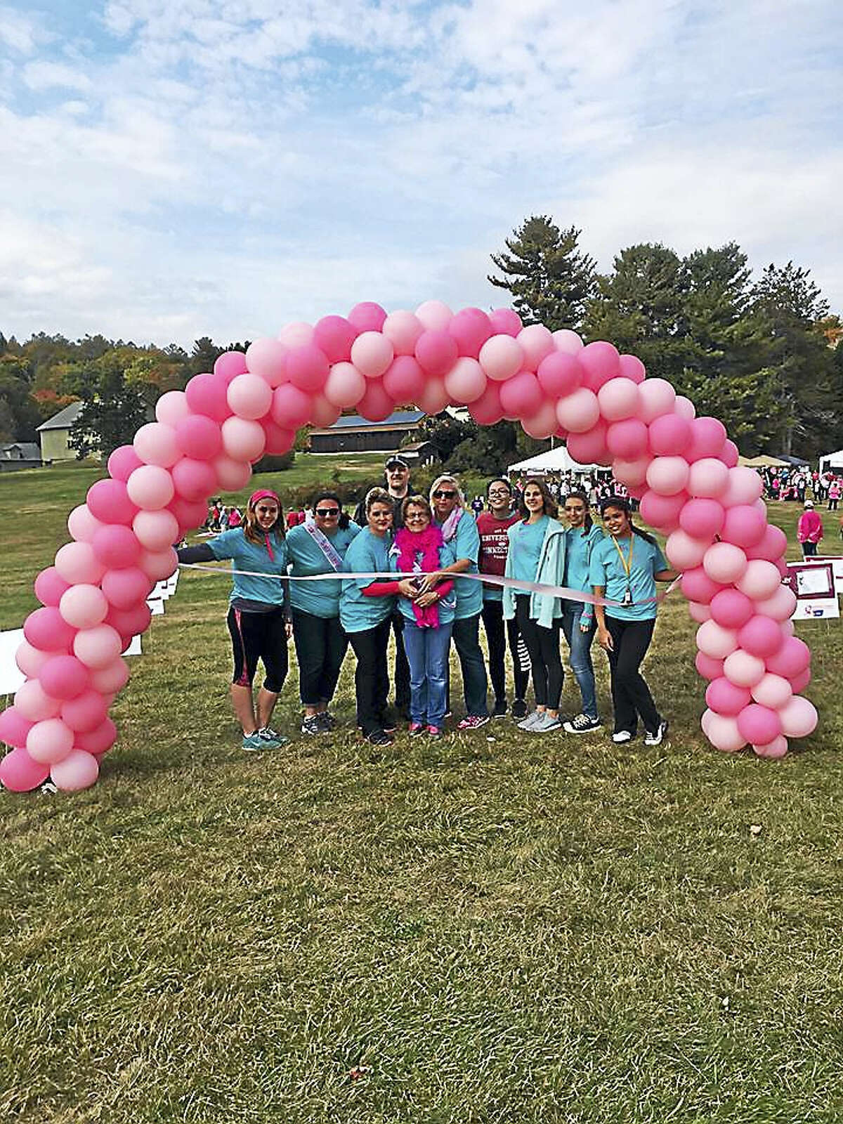 Contributed photo A team gathers for a photo at the Making Strides Against Breast Cancer walk, held Oct. 16 in Litchfield.