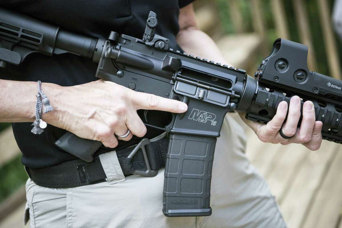 In this photo taken June 23, 2016, a Smith & Wesson M&P15 is held in Auburn, Georgia. An estimated 8 million AR-style guns have been sold since they were first introduced to the public in the 1960s, and about half of them are owned by current or former members of the military or law enforcement, according to the National Shooting Sports Foundation, which represents gunmakers.