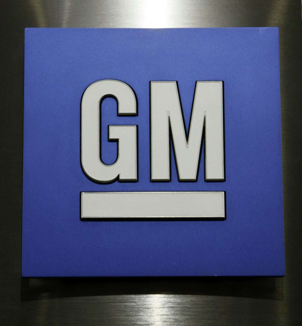 General Motors Co. logo is shown during a news conference in Detroit on Feb. 4, 2015.