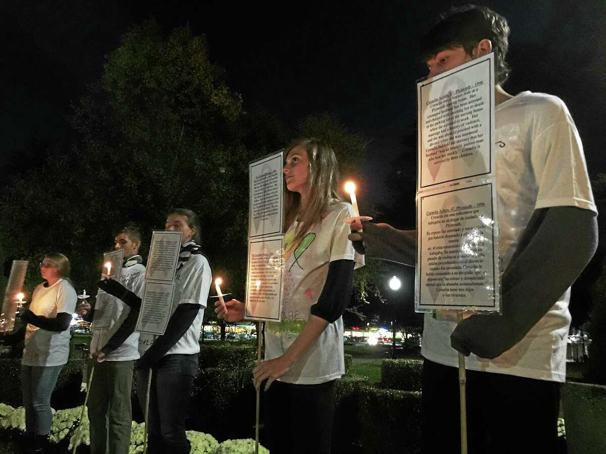 Members of the Thomaston High School Interact Club serve as live silent witnesses as part of the 27th annual candlelight vigil organized by the Susan B. Anthony Project Wednesday in Torrington.