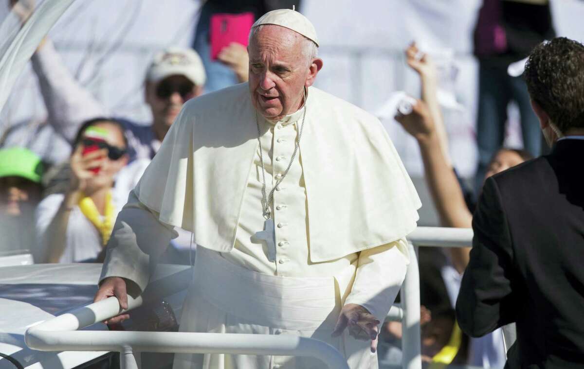 Pope Francis looks at the crowd that came to welcome him upon arrival to Benito Juarez International Airport in Ciudad Juarez, Mexico on Feb. 17, 2016. The pontiff is scheduled to wrap up his trip to Mexico on Wednesday with a visit in a Ciudad Juarez prison, just days after a riot in another lockup killed 49 inmates, and a stop at the Texas border when immigration is a hot issue for the U.S. presidential campaign.