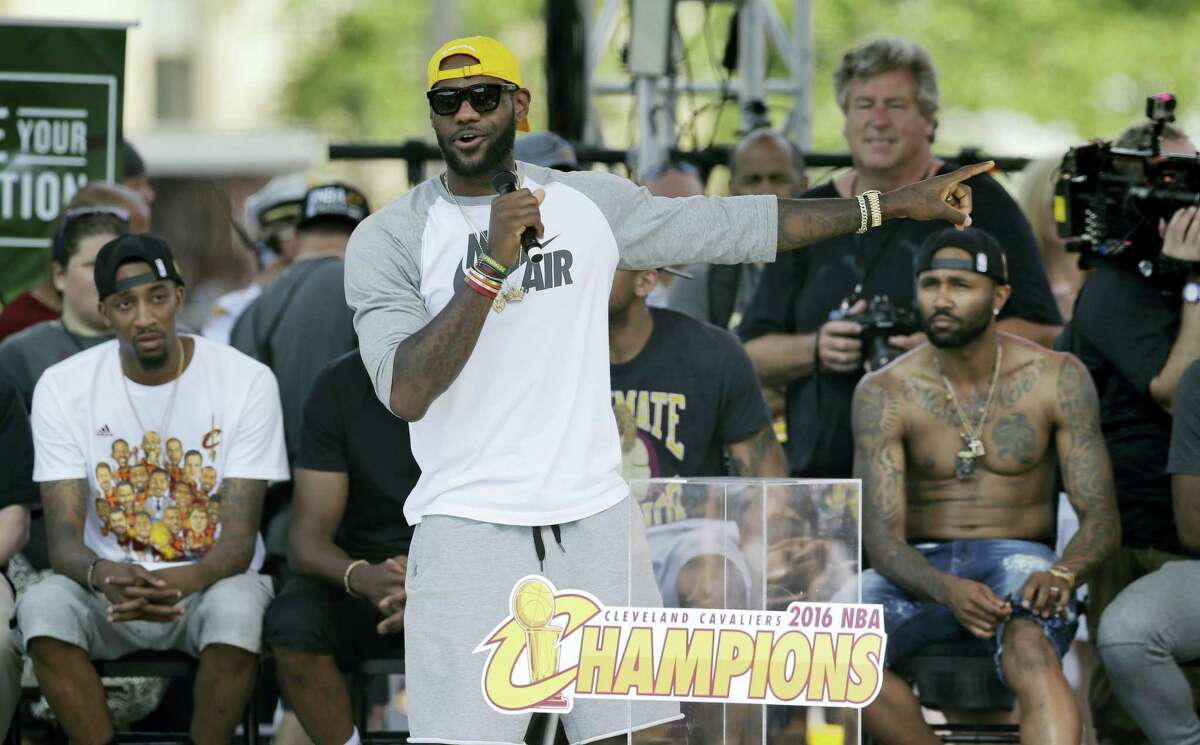 LeBron James talks about his teammates during a championship rally Wednesday in Cleveland.