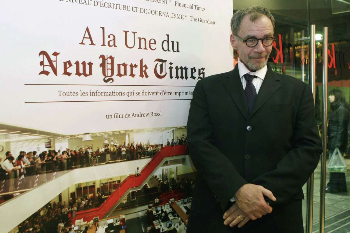 In this Nov. 21, 2011 photo, New York Times journalist David Carr poses for a photograph as he arrives for the French premiere of the documentary “Page One: A Year Inside The New York Times,” in Paris. Carr collapsed at the office and died in a hospital on Feb. 12, 2015.
