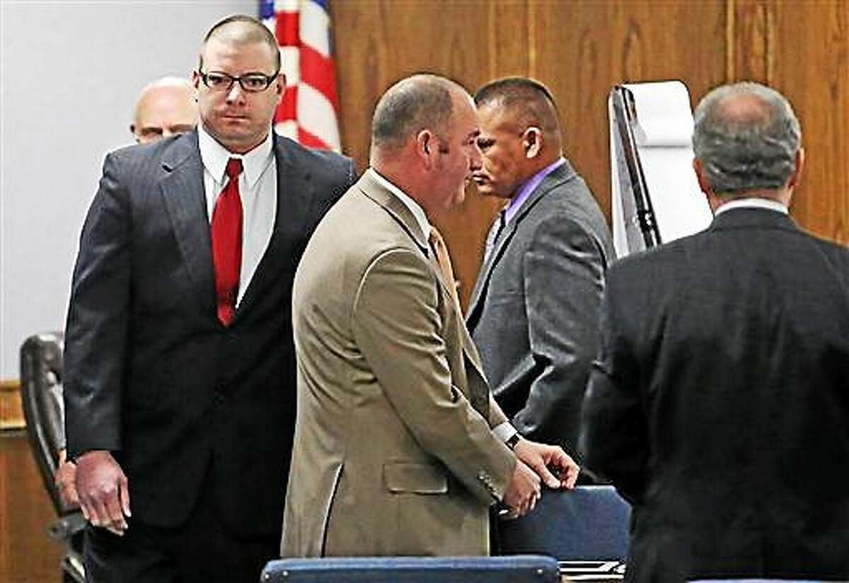 Former Marine Cpl. Eddie Ray Routh, left, enters the courtroom for his capital murder trial at the Erath County, Donald R. Jones Justice Center in Stephenville, Texas, Friday, Feb. 13, 2015. Routh, 27, of Lancaster, is charged with the 2013 deaths of former Navy SEAL Chris Kyle and his friend Chad Littlefield at a shooting range near Glen Rose, Texas.