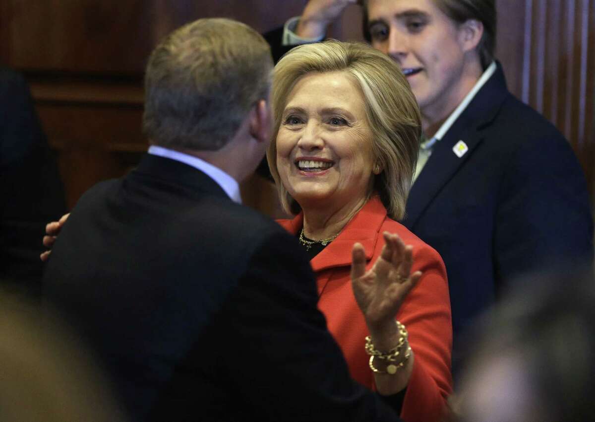 Democratic presidential candidate Hillary Rodham Clinton, center, greets people in the audience after addressing the crowd during a campaign stop at a Flag Day dinner on June 15, 2015, in Manchester, N.H.